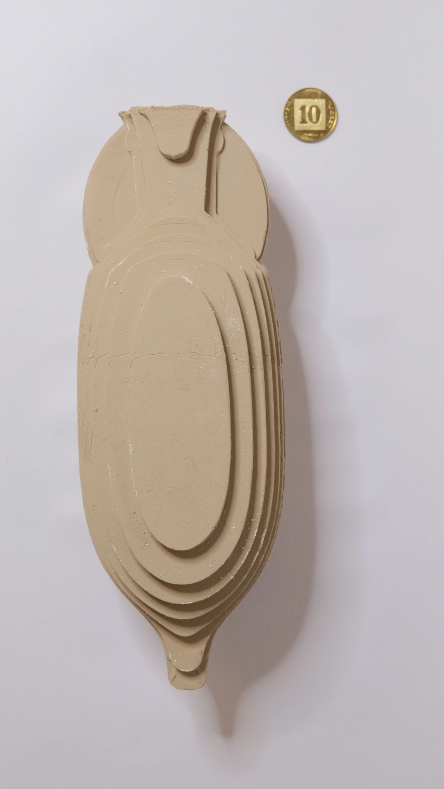 Stepped side of the large clay Amphora, showing broad concentric layers